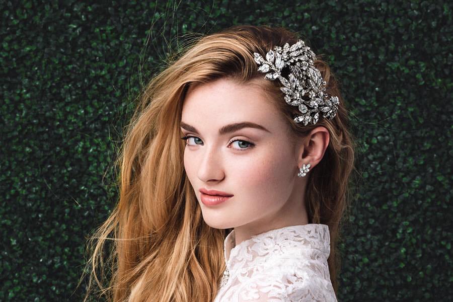 Model wearing silver headpiece