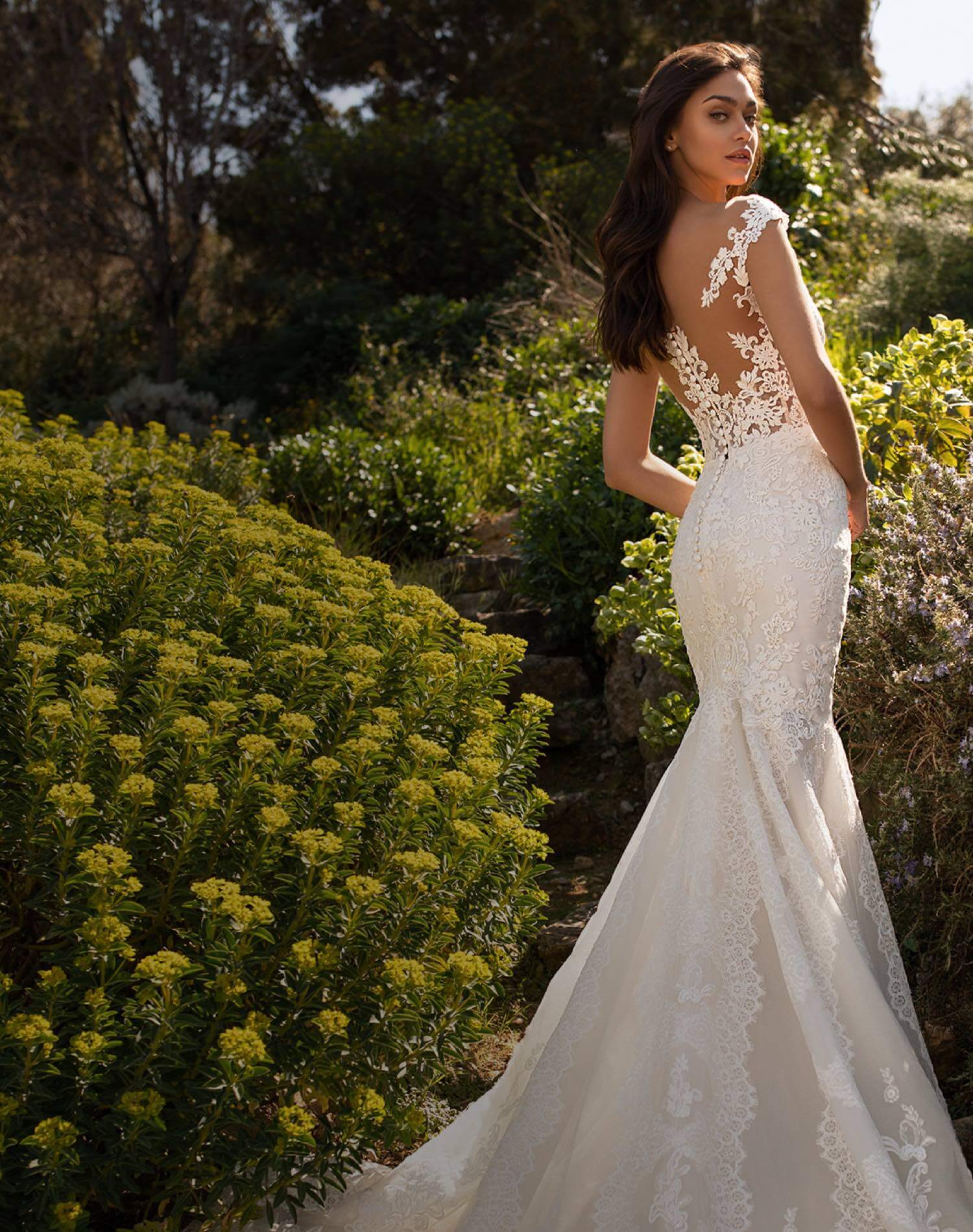Model wearing a Pronovias bridal gown shown on mobile device
